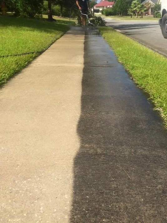 Sidewalk showing the difference before and after pressure washing